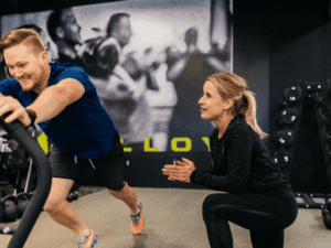 alloy personal training client with calf stretches